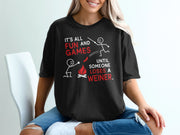 Black t-shirt with "It's All Fun And Games Until Someone Loses A Weiner" text and graphic.